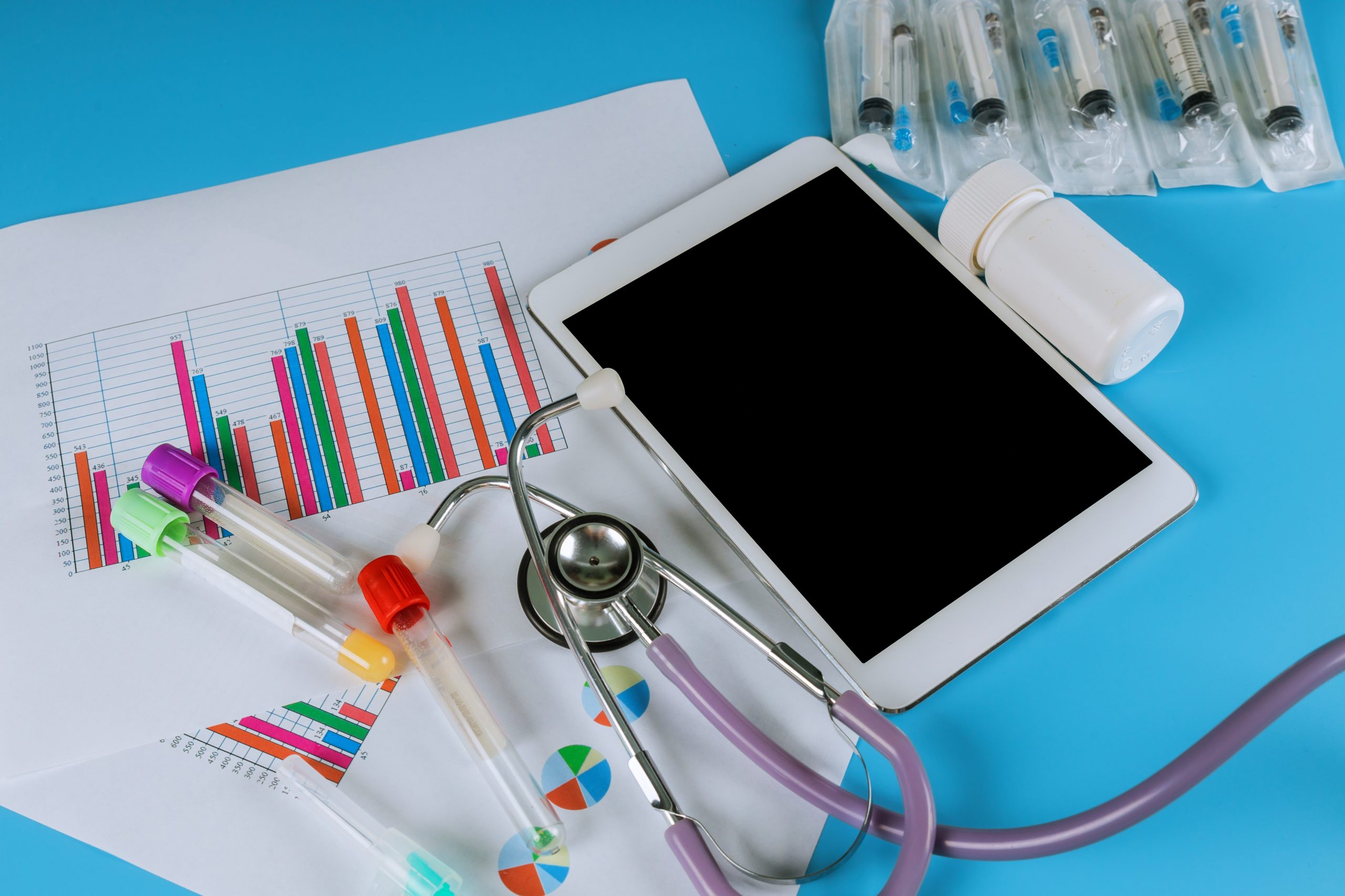 Medical statistics with tablet and stethoscope medical exam