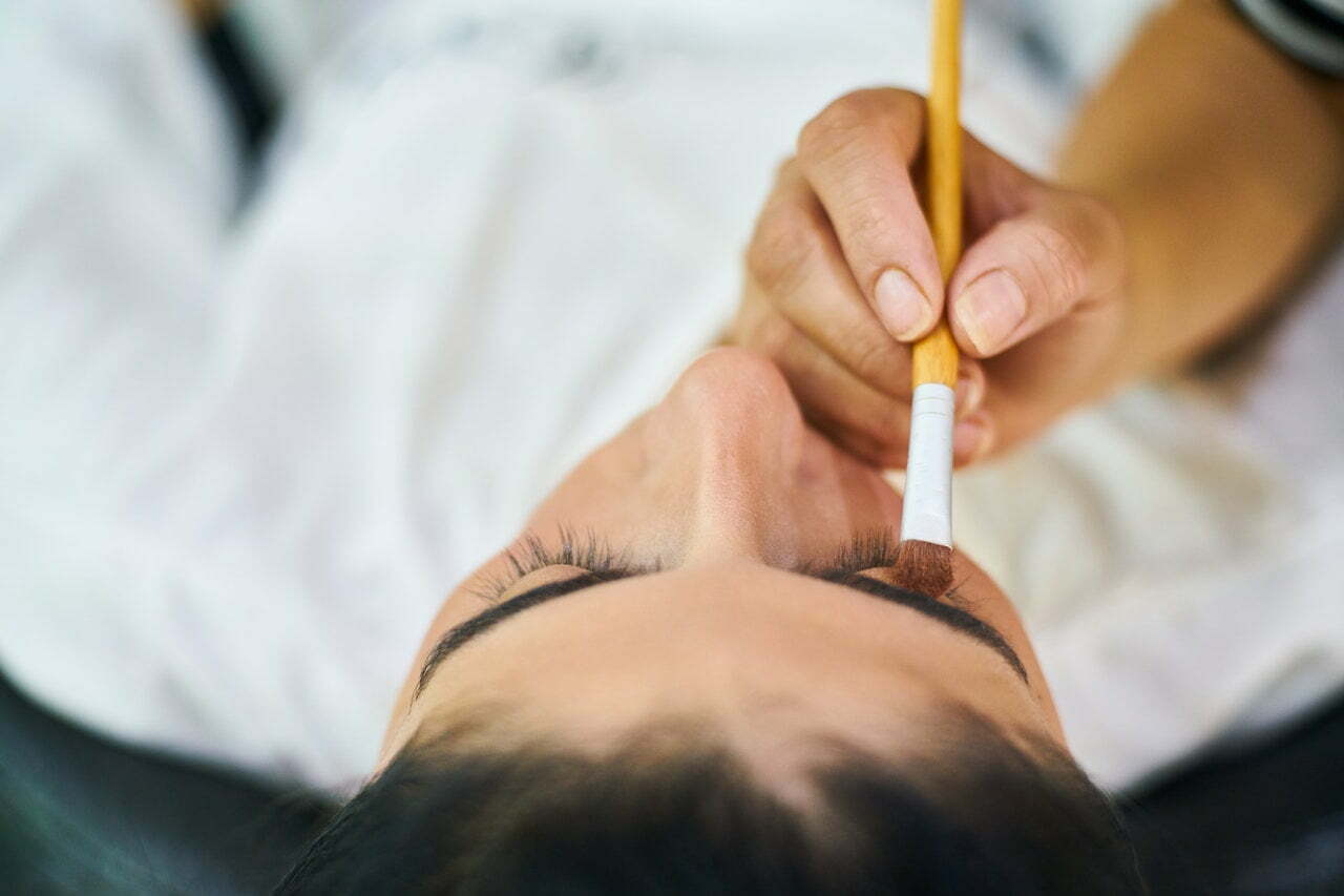a man's hand holding a pencil