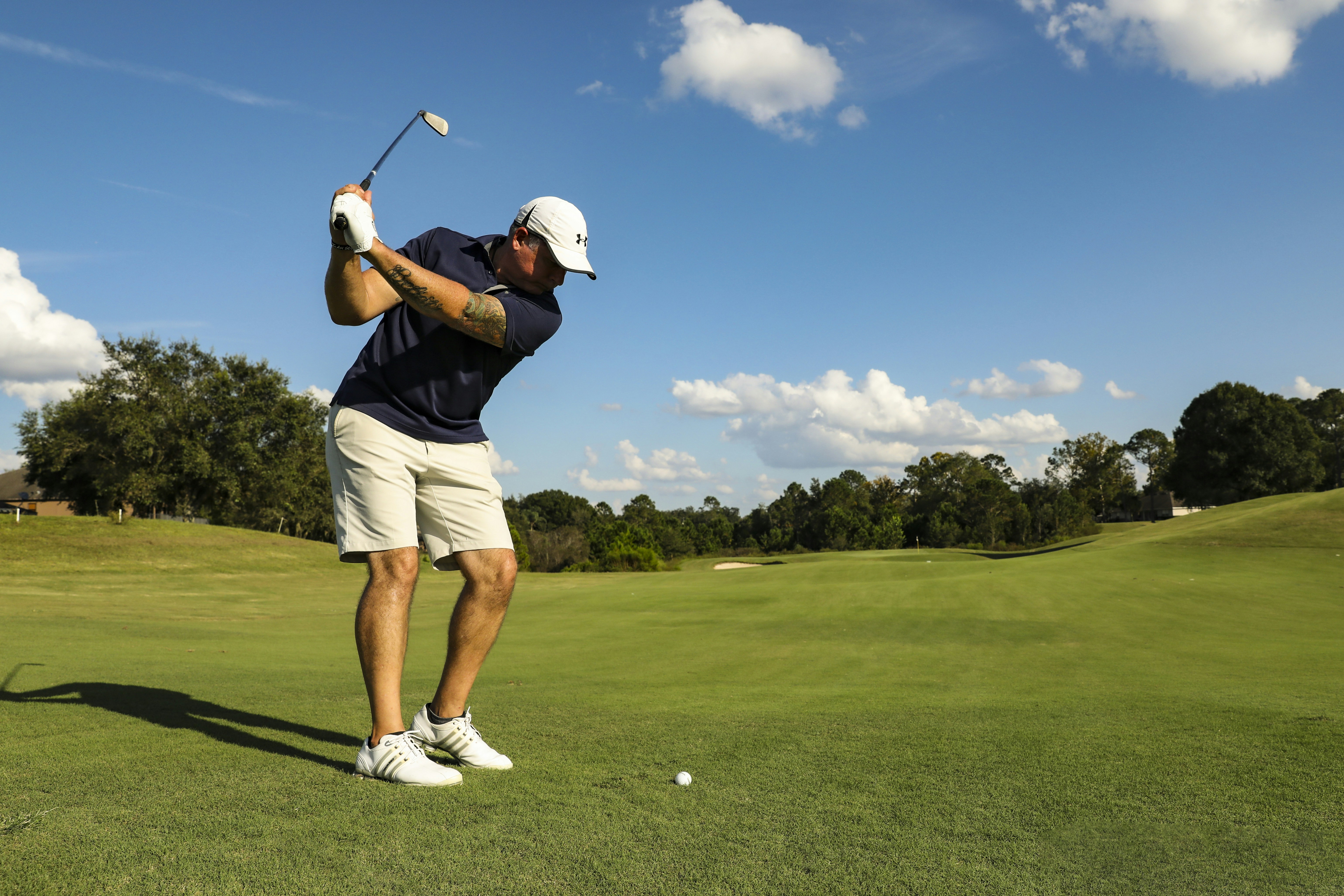 a man swinging a golf club