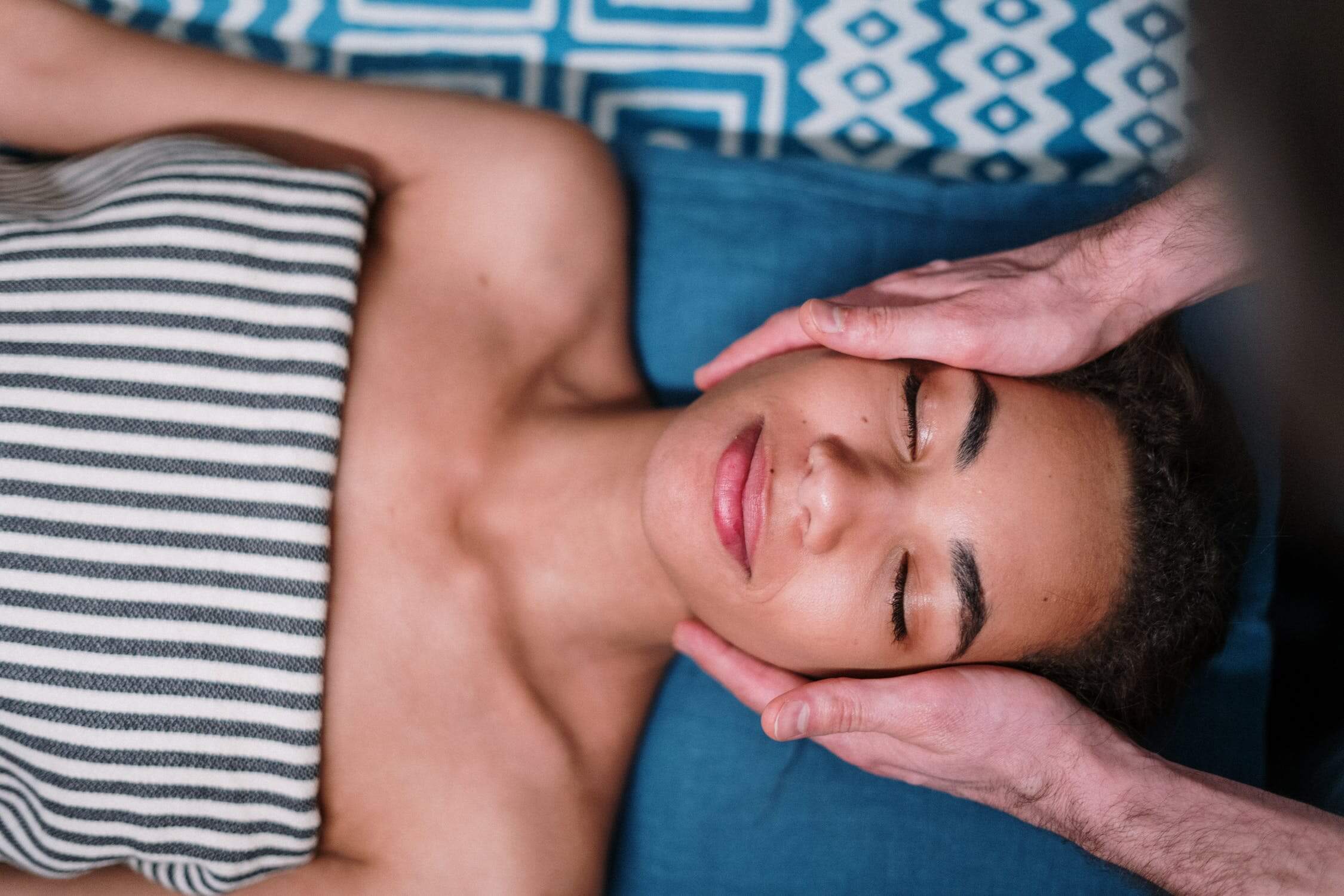 a person lying down with the hand on the chest