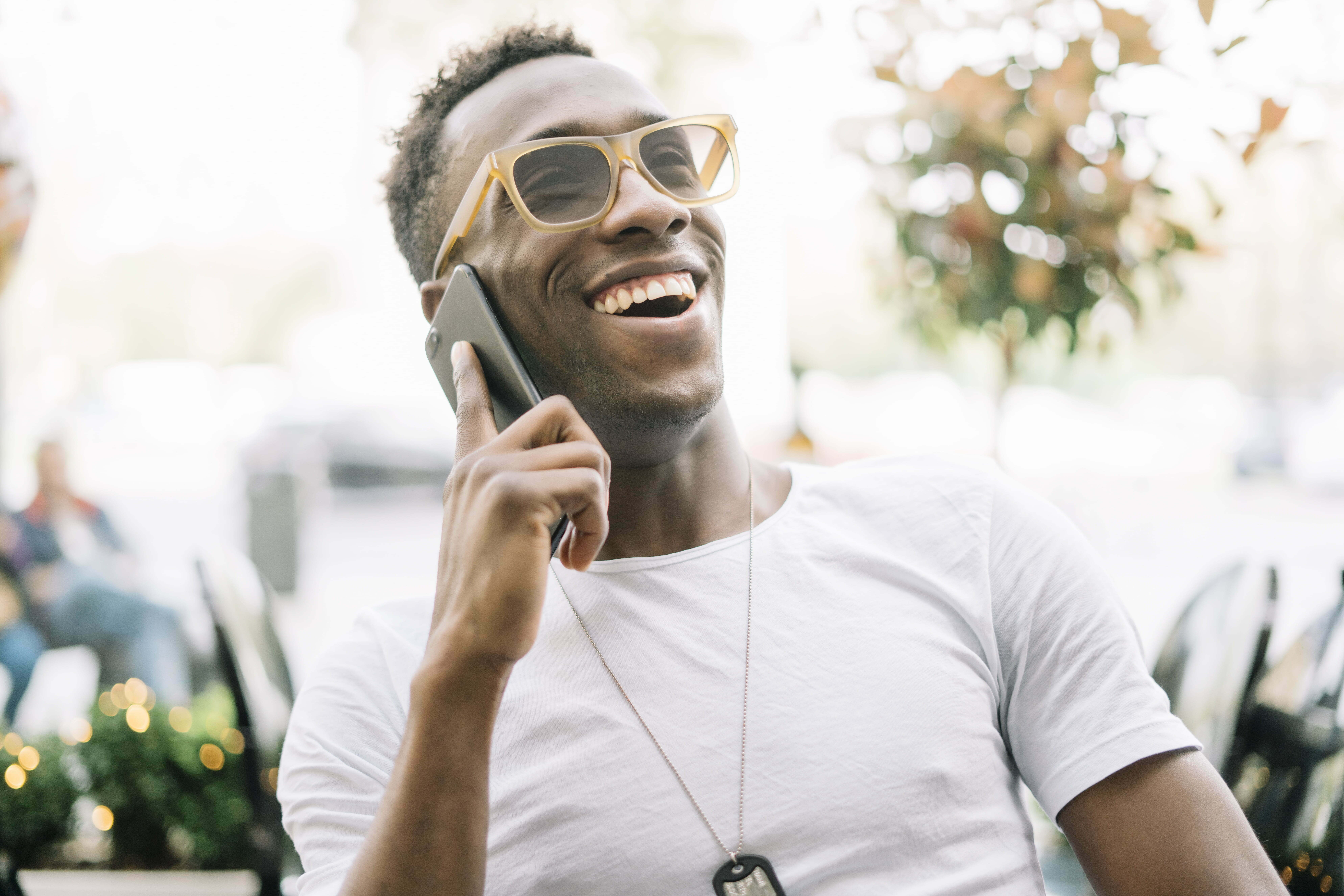 African man using mobile phone.