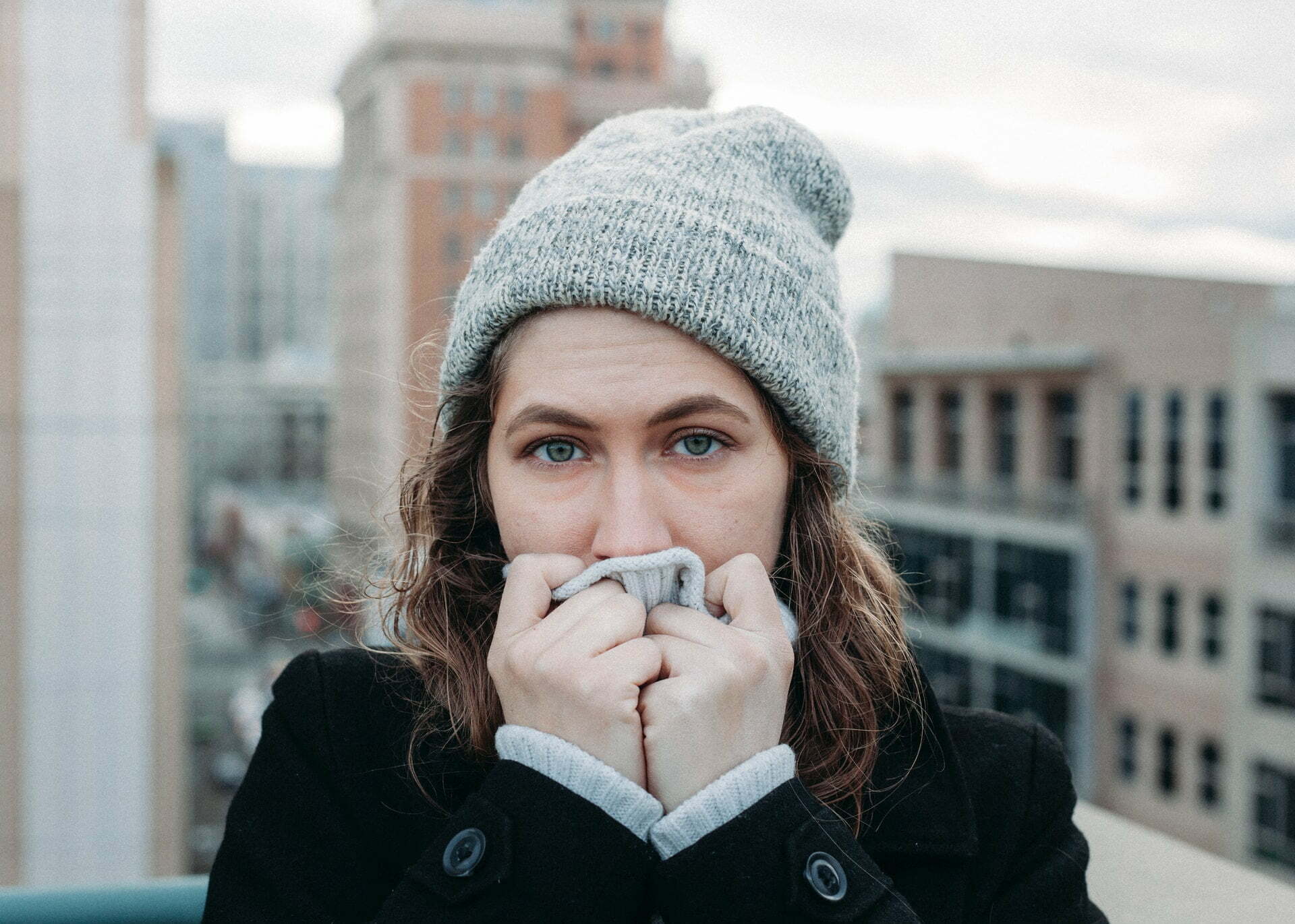 a woman with a beard and a hat