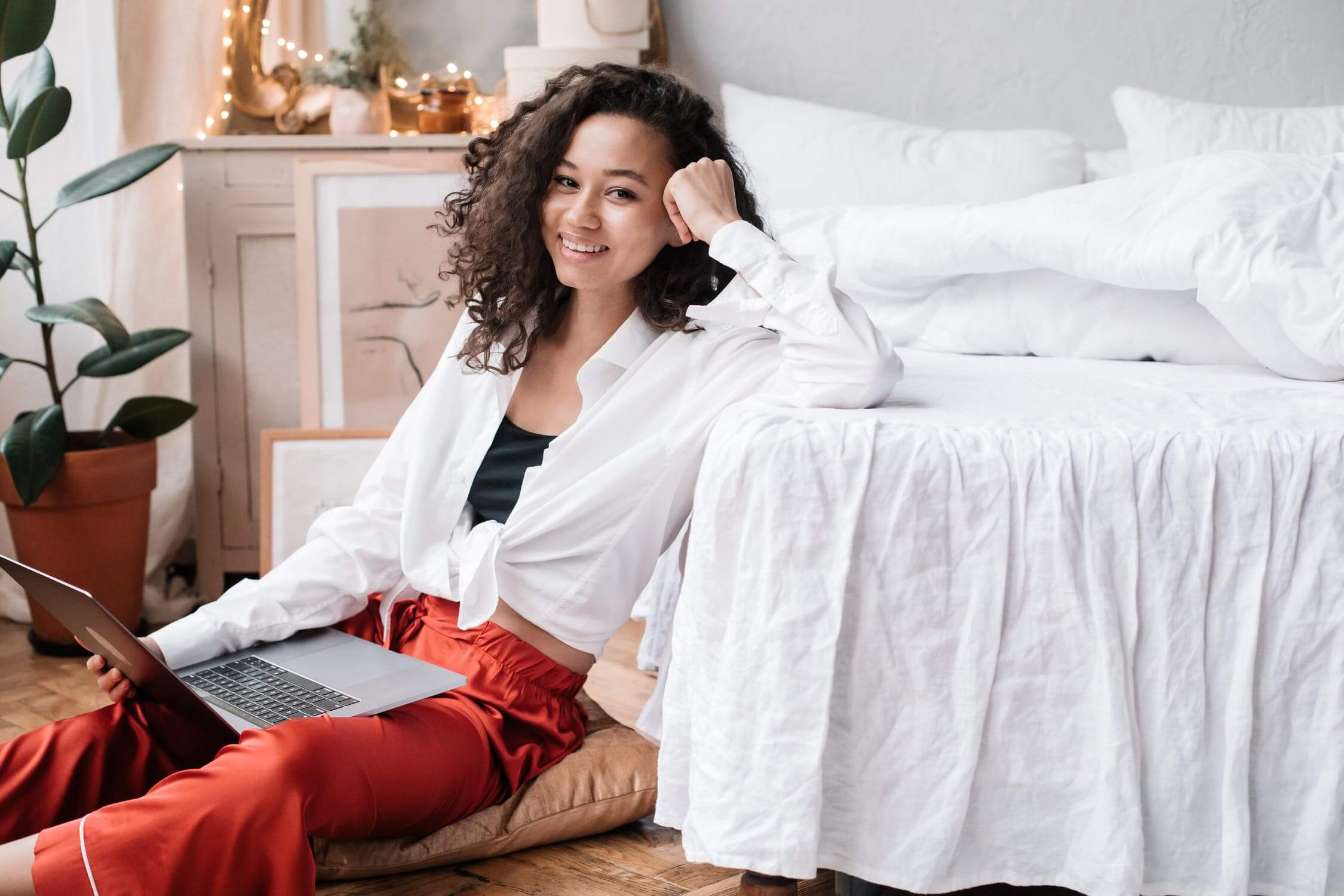 a woman sitting on a bed