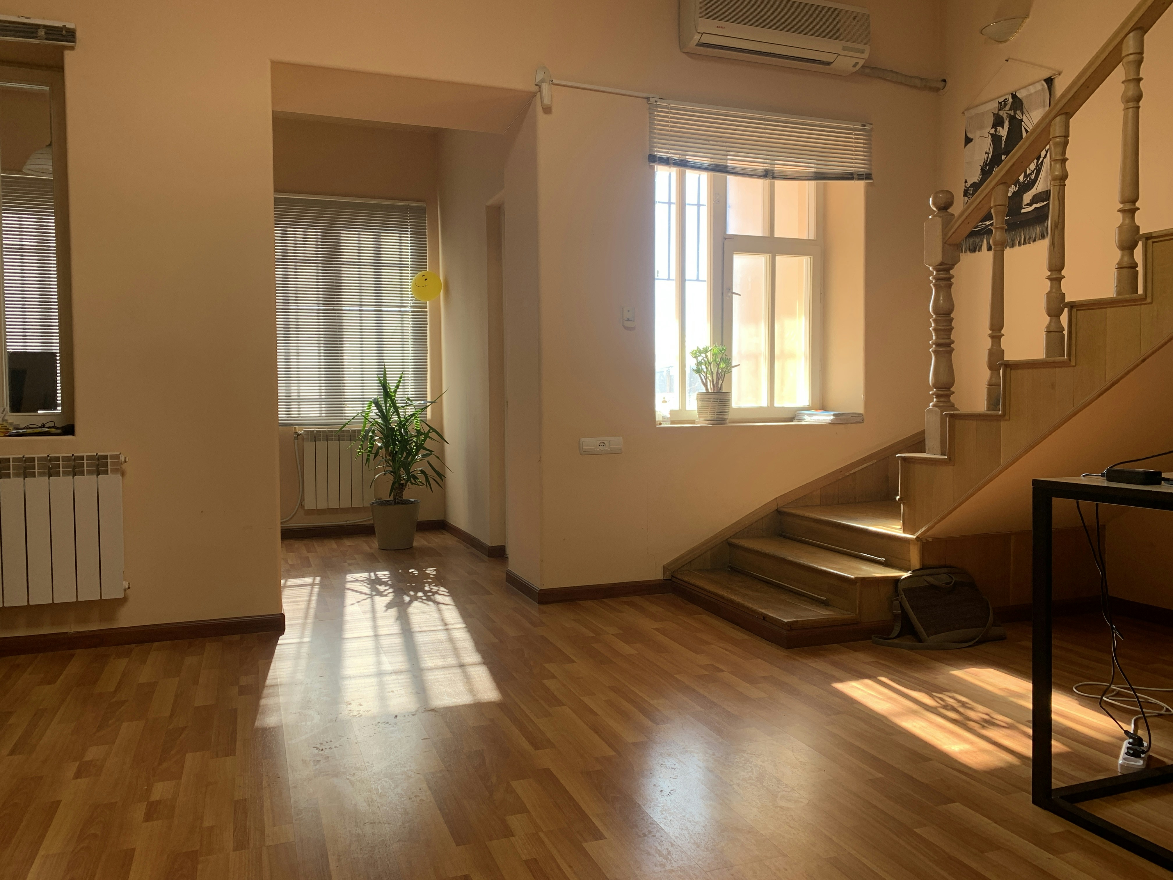 a room with a staircase and a window